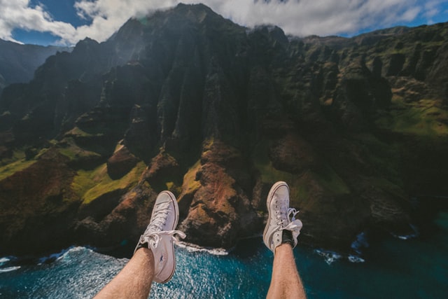 man-shoes-on-the-mountain-view