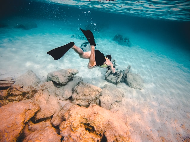 man-snorkeling-under-water