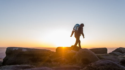 man-walking-sunset-view